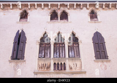 old windows on a medieval palace facade in Verona, Italy Stock Photo