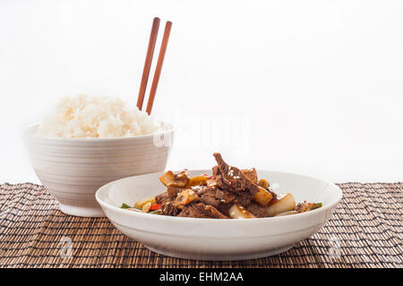 Stir Fried Beef and green bean dinner on white rice. Stock Photo