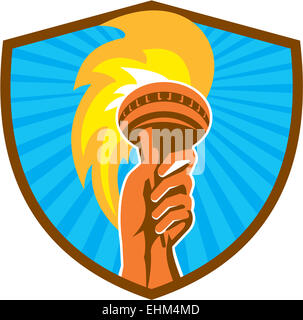 Illustration of a hand holding a burning flame flaming torch set inside shield crest done in retro style with sunburst in the background. Stock Photo