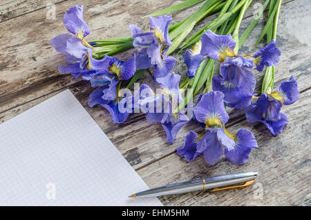 Bouquet blueflag or iris flower on wooden background. Overhead view Stock Photo