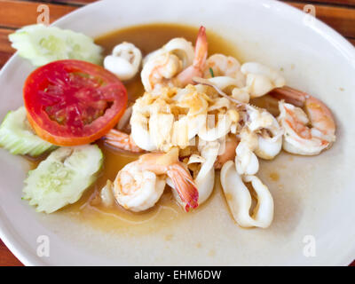 fried shrimps and ring of squid with oyster sauce Stock Photo
