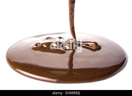 Chocolate flow isolated on white background close up Stock Photo