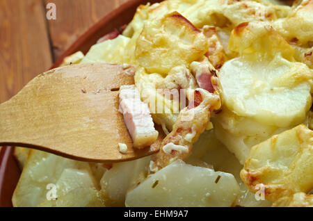 Tartiflette -  French dish from the Savoie and Haute Savoie region. made with potatoes, reblochon cheese, lardons and onions. Stock Photo