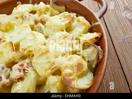 Tartiflette -  French dish from the Savoie and Haute Savoie region. made with potatoes, reblochon cheese, lardons and onions. Stock Photo