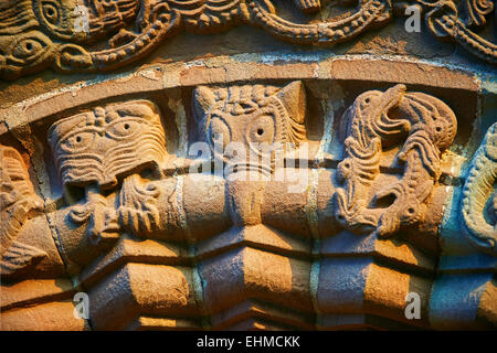 Norman Romanesque relief sculptures of dragons and mythical creatures, circa 1140, South doorway of Church of St Mary and St Stock Photo