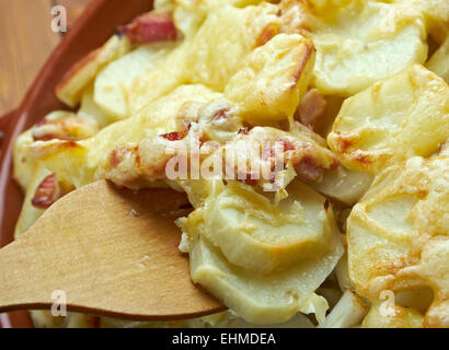 Tartiflette -  French dish from the Savoie and Haute Savoie region. made with potatoes, reblochon cheese, lardons and onions. Stock Photo