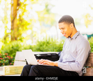 Smiling Businessman Working With Laptop Outdoors Stock Photo Alamy