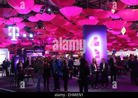 CeBIT computer fair 2015 in Hannover, Germany. Logo of German Telekom at their stand with hundreds of pink umbrellas forming a roof Stock Photo