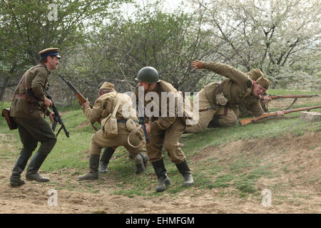 Re-enactors dressed as Soviet soldiers attend the re-enactment of the Battle at Orechov (1945) near Brno, Czech Republic. The Battle at Orechov in April 1945 was the biggest tank battle in the last days of the World War II in South Moravia, Czechoslovakia. Stock Photo