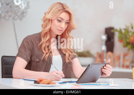 Beautiful young woman surfing in net Stock Photo
