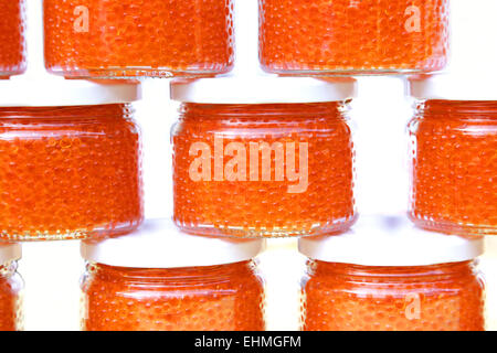 trout and salmon red caviar in glass jars Stock Photo