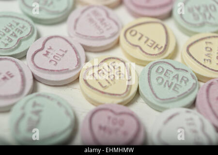 Heart shaped sweets or Candy with romantic messages inscribed in manufacture. True lips is the phrase in focus Stock Photo