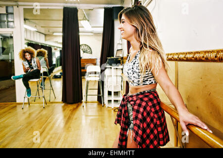 Dancer standing at bar in studio Stock Photo