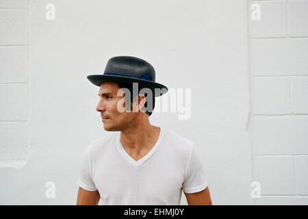 Mixed race man wearing hat outdoors Stock Photo