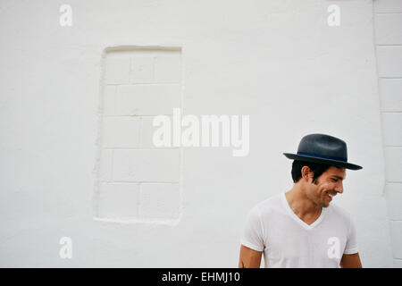 Mixed race man wearing hat outdoors Stock Photo