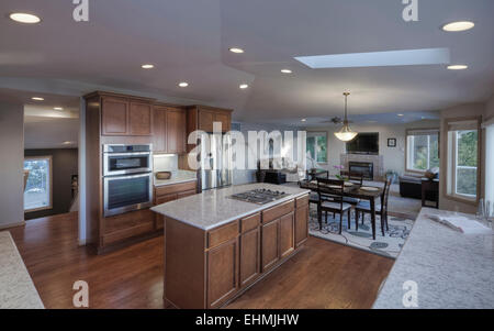 Island in open kitchen and dining room Stock Photo