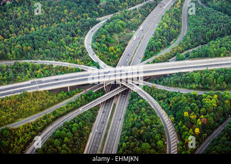 Aerial view of intersecting highways near trees, London, England Stock Photo