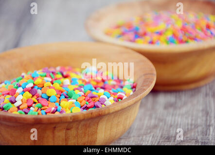 Colorful sprinkles in the bowl on the table