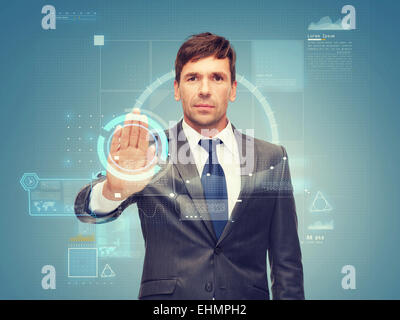 attractive buisnessman wotking with virtual screen Stock Photo