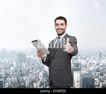 smiling buisnessman with tablet pc computer Stock Photo