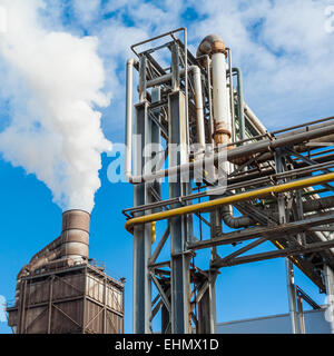 Chemical plant for the treatment of chipboard for furniture factory, with chimney Stock Photo