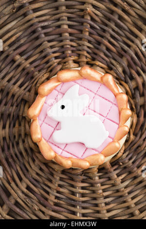 Round sugar cookie with a white Easter bunny made of fondant Stock Photo