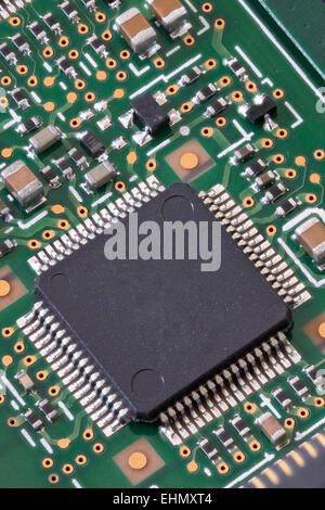 Macro shot of a circuit board with various microchips in high detail Stock Photo