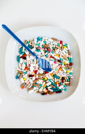 Capsules an pills in a plate. Stock Photo