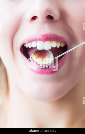 Woman getting dental examination at the dentist. Stock Photo