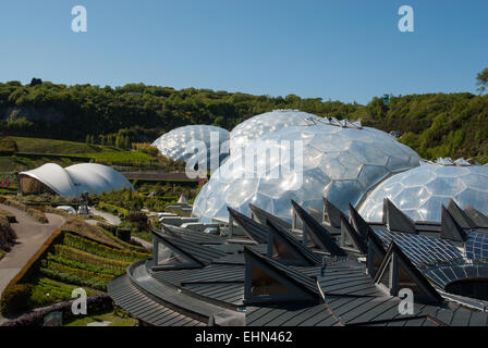 Wider image of Eden project biomes and landscape with the Core in the foreground Stock Photo