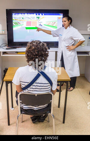 Hemiplegic patient after a stroke, and occupational therapist, Department of Physical Medicine and Rehabilitation Hospital of Bordeaux hospital, France. Stock Photo