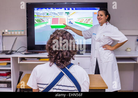 Hemiplegic patient after a stroke, and occupational therapist, Department of Physical Medicine and Rehabilitation Hospital of Bordeaux hospital, France. Stock Photo