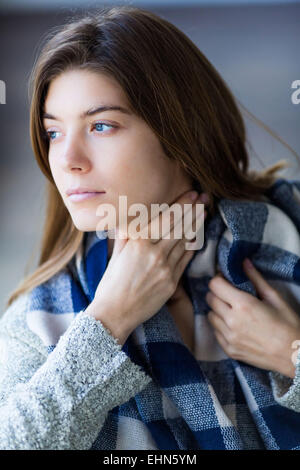 Woman stroking her throat Stock Photo - Alamy