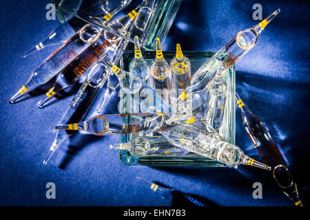 Glass ampoules of various trace elements. Stock Photo