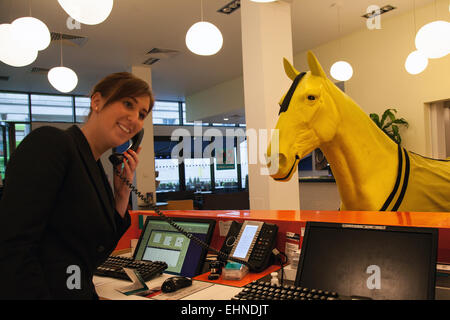 Liverpool, Merseyside, UK. 16th March, 2013. Grand National Event at the Indigo Hotel. Employees of Grand National sponsor Crabbies are planning to stay at the Hotel Indigo on Chapel Street during the period of the April race meeting. Today two life-size yellow horses arrived outside the hotel as a promotion for the oncoming event. Credit:  Mar Photographics/Alamy Live News Stock Photo