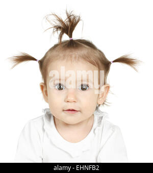 Funny Little Girl With A Funny Hairstyle Standing Smiling On