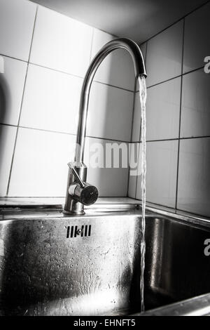 Water running from a tap. Stock Photo