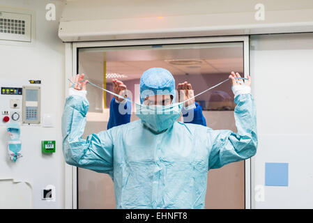 Surgical team getting dressed before surgery, Jouvenet clinic, Paris, France. Stock Photo
