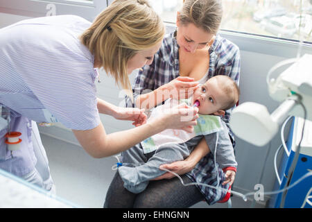 Baby affected by a urinary tract infection (pyelonephritis) hospitalized in the pediatric department of Angoulême hospital, France. Stock Photo