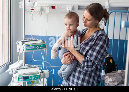 Baby affected by a urinary tract infection (pyelonephritis) hospitalized in the pediatric department of Angoulême hospital, France. Stock Photo