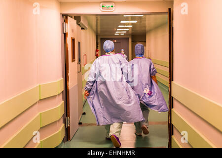 Surgical team in an hospital corridor. Stock Photo