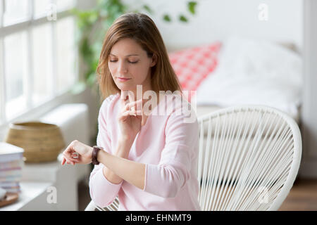 Woman checking pulse. Stock Photo