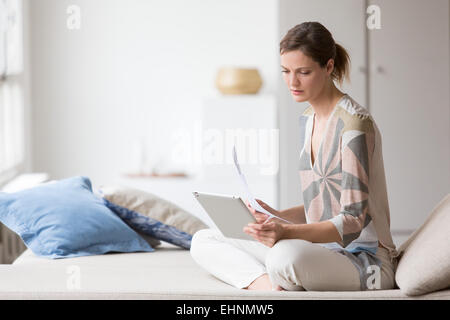 Woman using digital tablet. Stock Photo