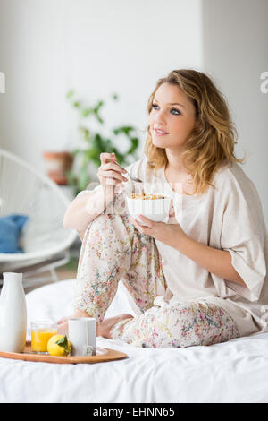 Woman having breakfast. Stock Photo