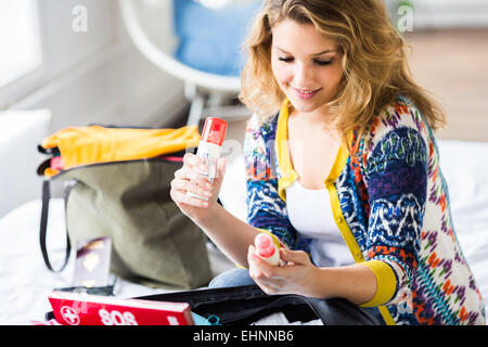 Woman preparing first aid kit. Stock Photo