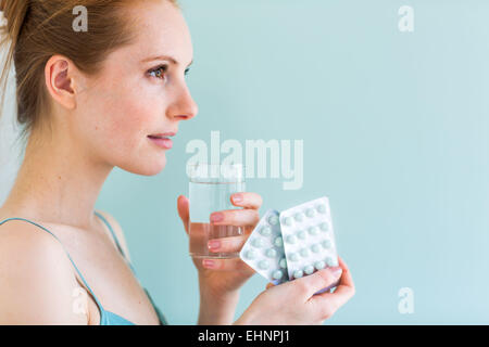 Woman taking medicines. Stock Photo