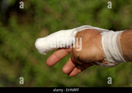 white medicine bandage on injury finger Stock Photo