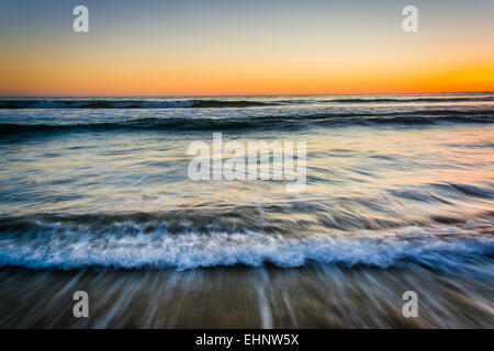 Sunset over waves in the Pacific Ocean, in Santa Monica, California. Stock Photo