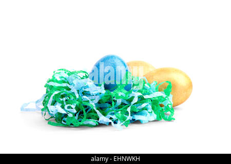 multicolored Easter eggs in paper nest Stock Photo