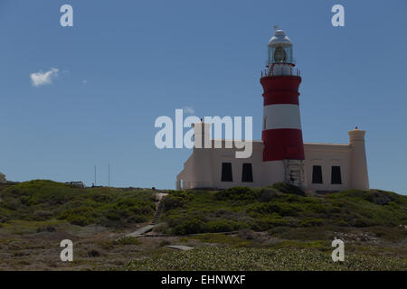 The Cape Aghulas lighthouse at the southern most point of Africa Stock Photo